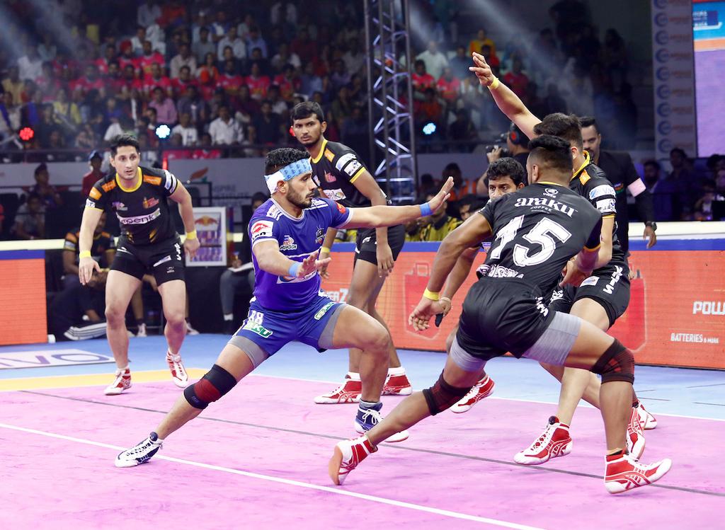 Haryana Steelers' Vikash Khandola showcases his raiding skills against Telugu Titans defence