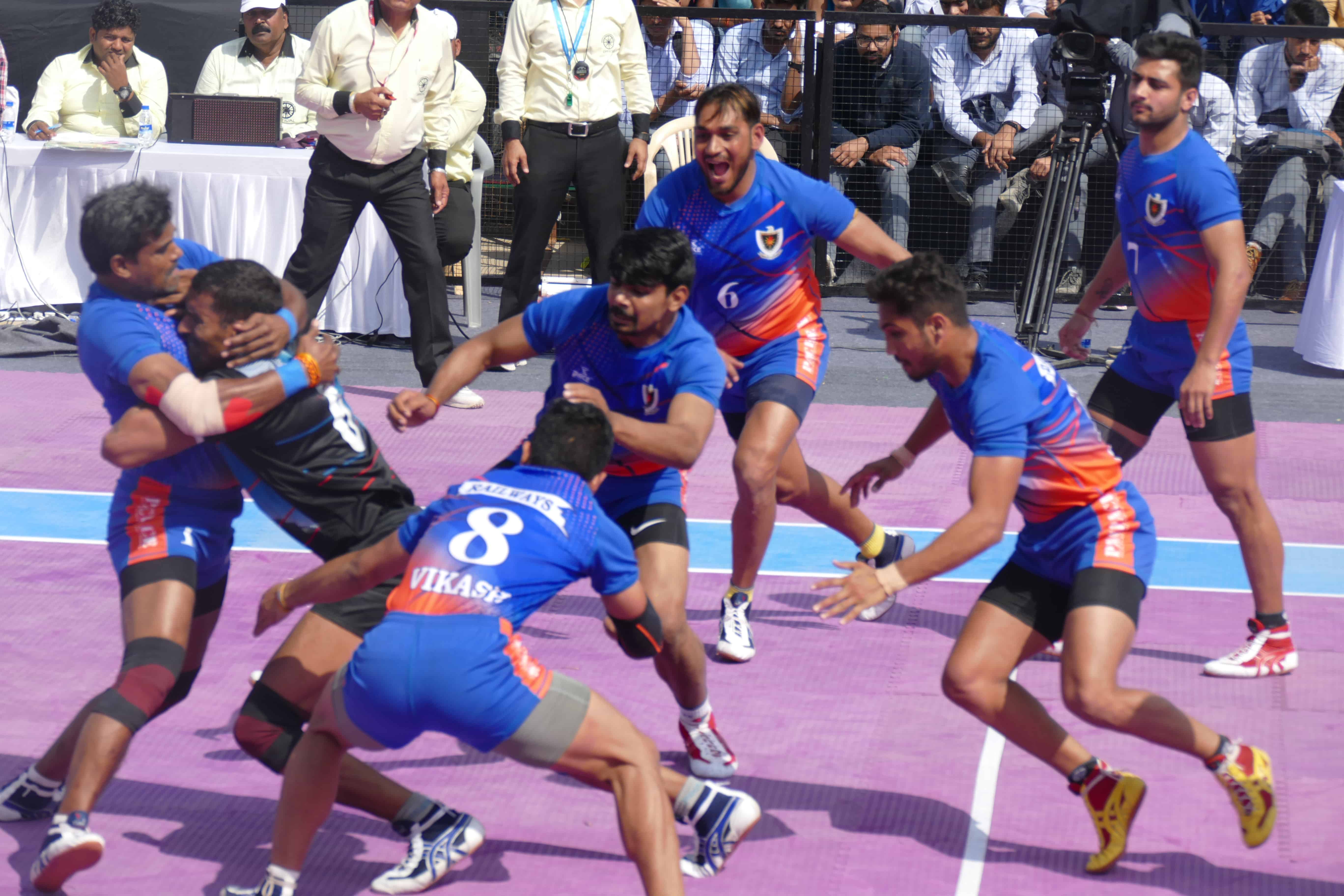 Dharmaraj Cheralathan tackling a raider