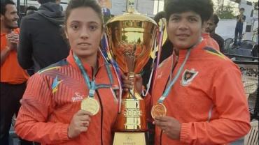 Pinky Roy and Ritu Negi holding 67th Senior National winning Trophy in hand at Poornima University, Jaipur